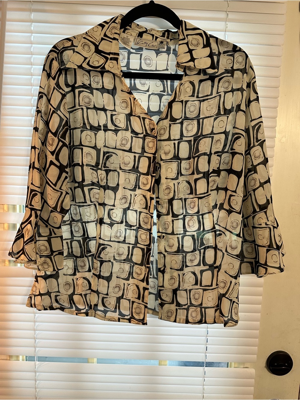Vintage-Inspired Black and Cream Geometric Button-Front Blouse